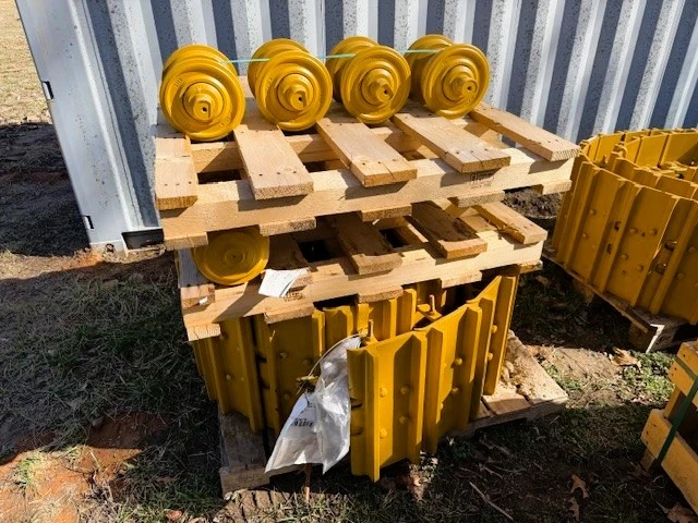 Tracks resting on wooden pallet