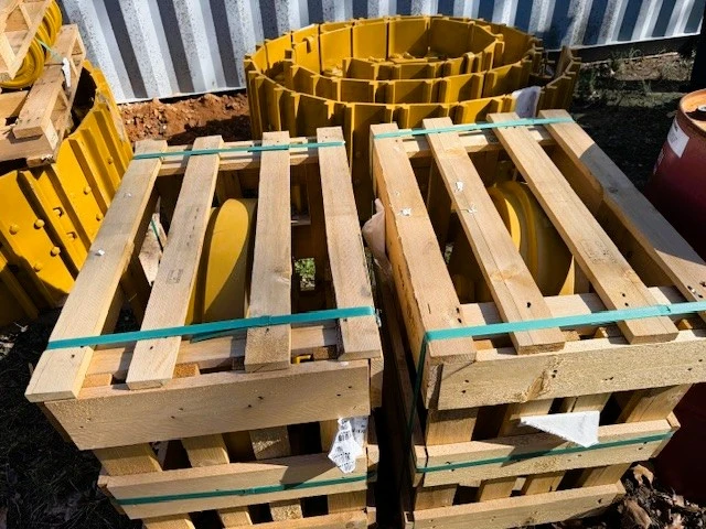 close up of tracks resting on wooden pallet